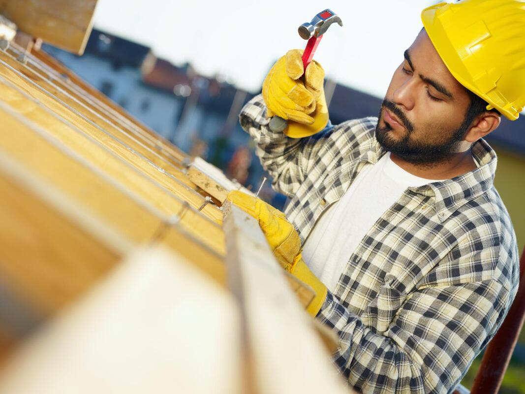 a worker using hammer 